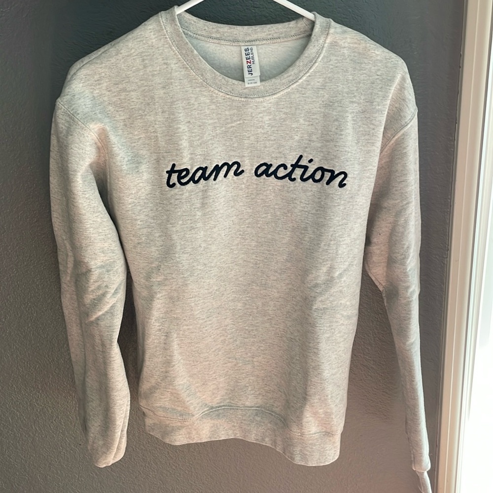 Warm cozy Team Action sweater